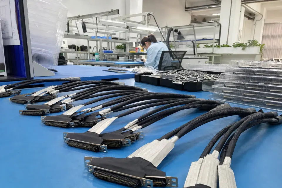 40-pin eDP cable assembly production-support workstation inside a Chinese electronics cable factory