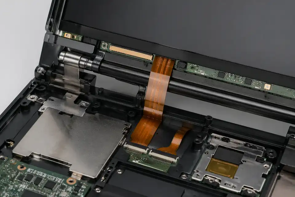 FFC and FPC assembly near a compact display terminal hinge zone