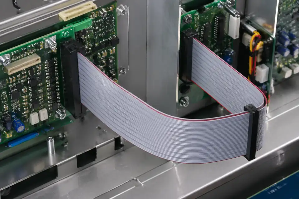 Ribbon IDC assembly connecting control modules inside equipment