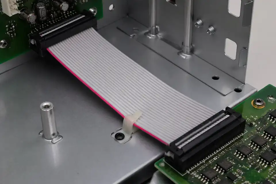 Ribbon IDC flat cable assembly inside a routine electronics chassis