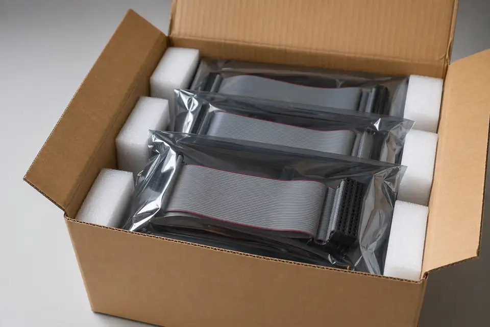 Ribbon IDC samples or batches in anti-static bags, foam, and carton protection ready for shipment