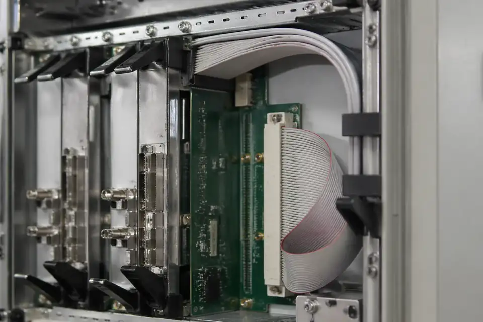IDC ribbon harness inside a telecom base communication module