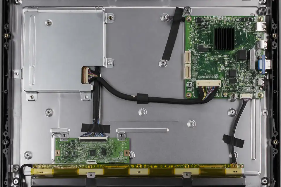 LVDS route inside a panel-PC display module with replacement-aware internal layout
